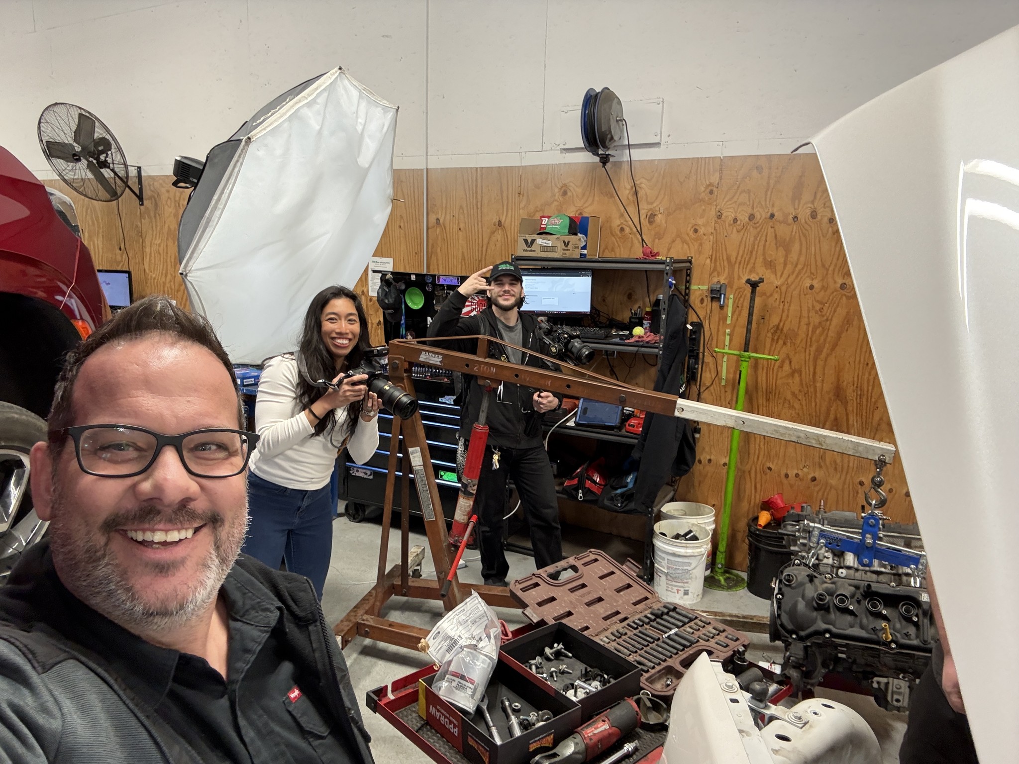 Graham Kuhn with his crew on a shoot in an auto shop